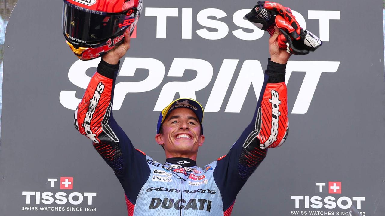 Ducati Spanish rider Marc Marquez celebrates on the podium winning the sprint race of the MotoGP Aragon Grand Prix at the Motorland circuit in Alcaniz, northeastern Spain, on August 31, 2024. (Photo by Pierre-Philippe MARCOU / AFP)