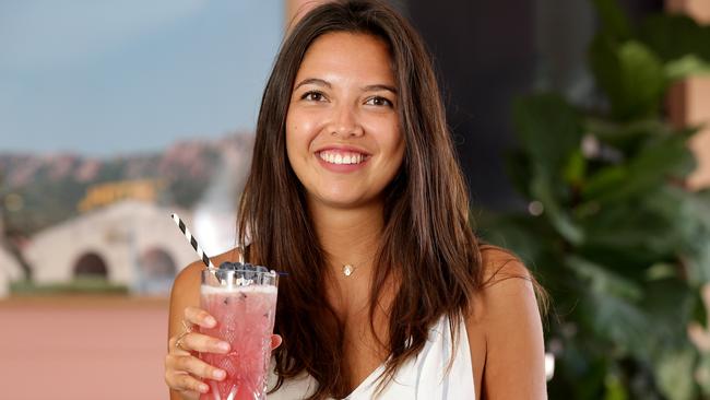 Pauline Lefur, 24, tries The New Guard cocktail — packed with healthy ingredients — at Hotel Ravesis at Bondi Beach. Picture: Jonathan Ng