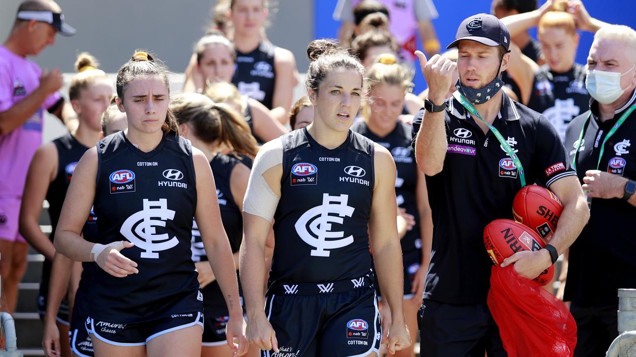 MELBOURNE, AUSTRALIA - FEBRUARY 06: Kerryn Harrington of the Blues leads her team on to the ground during the 2022 AFLW Round 05 match between the Carlton Blues and the Adelaide Crows at Ikon Park on February 6, 2022 in Melbourne, Australia. (Photo by Dylan Burns/AFL Photos via Getty Images)