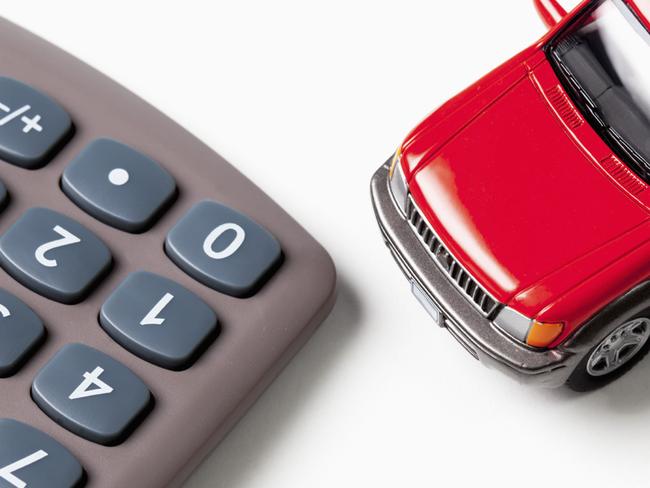 Calculator and toy car on white background