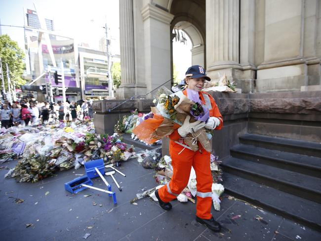 Suspicious Device found in Bourke Street memorial flowers. SES volunteers return to remove flowers from site. Picture David Caird