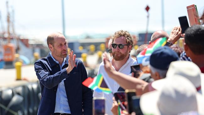 Prince William, Prince of Wales is greeted by well-wishers during a visit to Kalk Bay Harbour. Picture: Getty