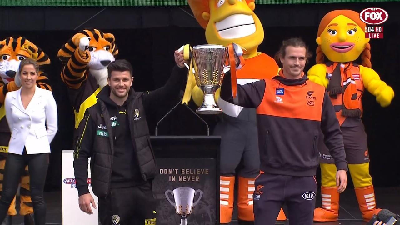 Richmond's Trent Cotchin and GWS' Phil Davis hold up the premiership cup at the end of the Grand Final Parade.