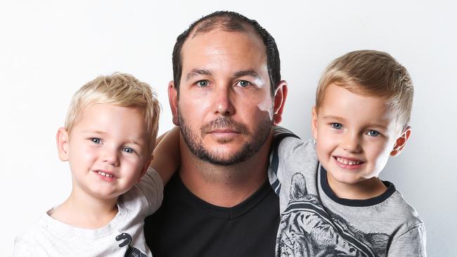 Phil Beckett, pictured with sons Easton, 2, and Xander, 4, has been diagnosed with silicosis. Picture: Nigel Hallett