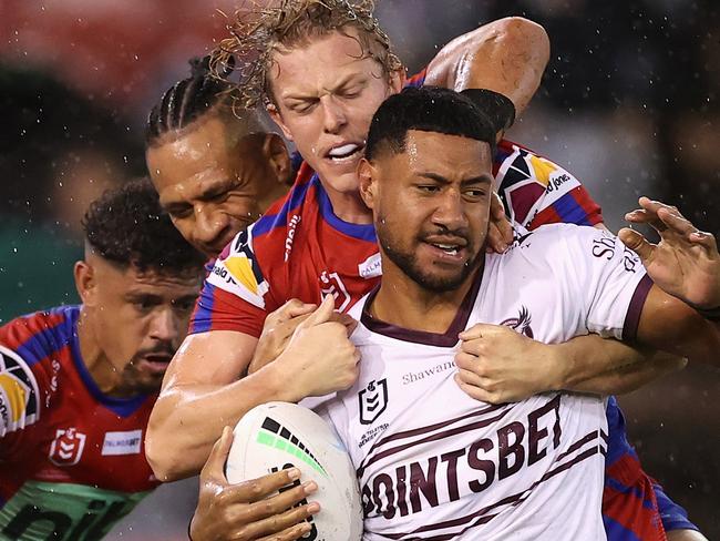 NEWCASTLE, AUSTRALIA - APRIL 07: Haumole Olakau'atu of the Sea Eagles is tackled during the round five NRL match between the Newcastle Knights and the Manly Sea Eagles at McDonald Jones Stadium, on April 07, 2022, in Newcastle, Australia. (Photo by Cameron Spencer/Getty Images)