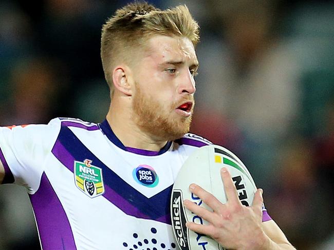 Cameron Munster of the Storm gets past Jared Waerea-Hargreaves of the Roosters during the Sydney Roosters v Melbourne Storm NRL round 14 game at Allianz Stadium, Sydney. pic Mark Evans