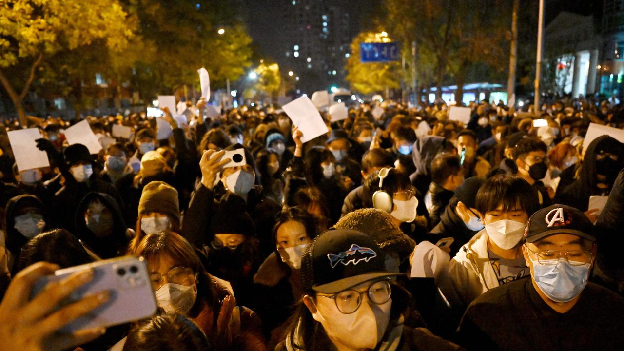 Chinese people protest in response to a deadly fire — apparently accerbated by lockdowns hampering rescue efforts — and the country’s harsh Covid-19 restrictions in Beijing on November 28, 2022. Picture: Noel Celis/AFP