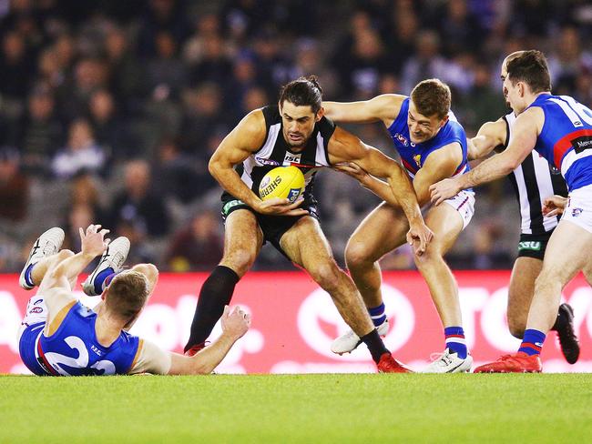 MELBOURNE, AUSTRALIA - MAY 25:  Brodie Grundy of the Magpies is tackled by Jackson Macrae of the Bulldogs during the round 10 AFL match between the Collingwood Magpies and the Western Bulldogs at Etihad Stadium on May 25, 2018 in Melbourne, Australia.  (Photo by Michael Dodge/Getty Images)