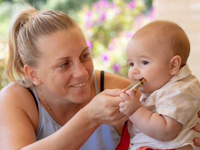 Former Olympic boxer and Commonwealth Gold medalist, Shelley Watts with her 5 month old baby son Chase Davidson holding her Commonwealth gold medal. Pictured at her home in Port Macquarie NSW. Speaking about the financial hardship Olympic athletes face. Pic: Lindsay Moller.