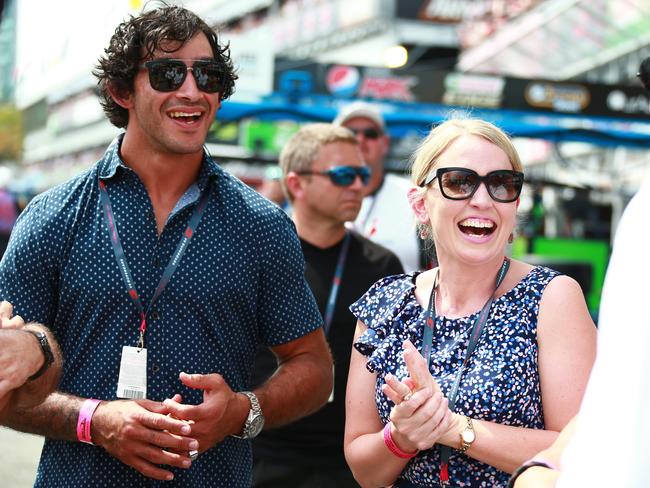 NRL star Jonathan Thurston and then Mayor Events Minister Kate Jones tour pit lane during the 2015 Gold Coast 600 event. Picture: Kit Wise.