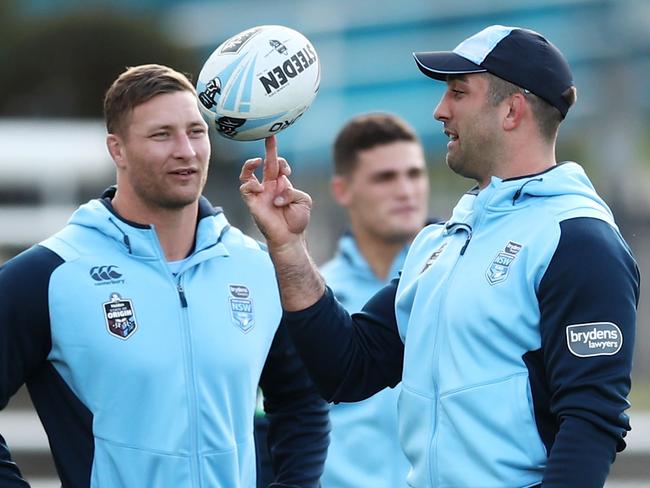 SYDNEY, AUSTRALIA - JULY 02:  Tariq Sims (L) and Paul Vaughan (R) walk in bare feet during a New South Wales Blues State of Origin Recovery Session at Coogee Oval on July 2, 2018 in Sydney, Australia.  (Photo by Matt King/Getty Images)