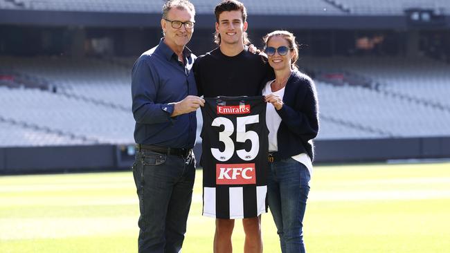 Nick Daicos with his dad Peter and mum Colleen at the MCG. Picture: Michael Klein