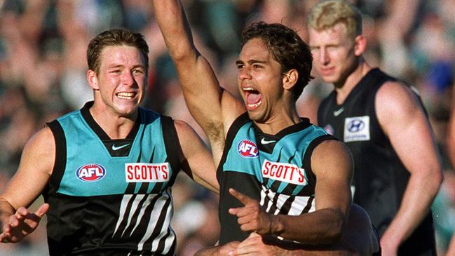 Peter Burgoyne celebrates kicking the goal after the siren.