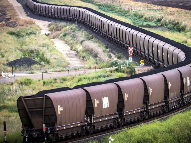 A freight train transports coal from the Gunnedah Coal Handling and Prepararation Plant, operated by Whitehaven Coal Ltd., in Gunnedah, New South Wales, Australia, on Tuesday, Oct. 13, 2020. Prime Minister Scott Morrison warned last month that if power generators don't commit to building 1,000 megawatts of gas-fired generation capacity by April to replace a coal plant set to close in 2023, the pro fossil-fuel government would do so itself. Photographer: David Gray/Bloomberg