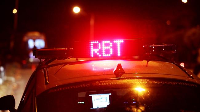 Police conduct a roadside breath testing operation. Picture: Alix Sweeney.