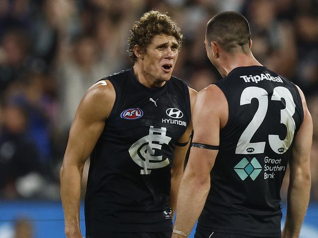 MELBOURNE, AUSTRALIA - MARCH 23: Charlie Curnow of the Blues (L) celebrates with Jacob Weitering of the Blues on the final siren after winning the round two AFL match between Carlton Blues and Geelong Cats at Melbourne Cricket Ground, on March 23, 2023, in Melbourne, Australia. (Photo by Daniel Pockett/Getty Images)