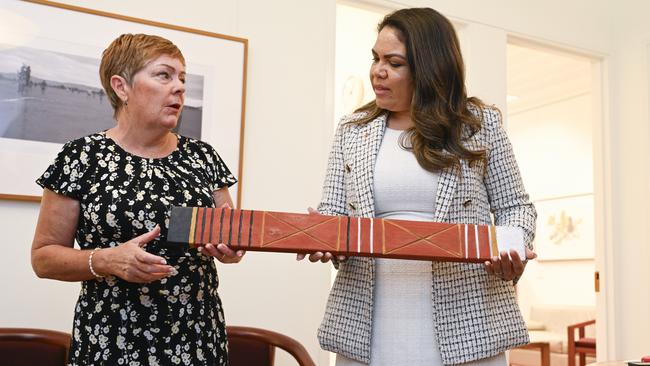 Margaret Andrews, wife of late Liberal MP Kevin Andrews hands Senator Jacinta Nampijinpa Price the message stick. Picture: NewsWire / Martin Ollman