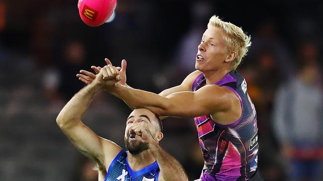 Isaac Heeney flies for a mark over Steele Sidebottom. Picture: Getty Images