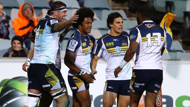 CANBERRA, AUSTRALIA - JULY 11: The Brumbies celebrate after Henry Speight of the Brumbies scored a try during the round 19 Super Rugby match between the Brumbies and the Force at Canberra Stadium on July 11, 2014 in Canberra, Australia. (Photo by Mark Nolan/Getty Images)