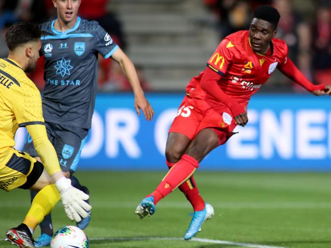 Al Hassan Toure of United scores a goal during the Round 1 A-League match between Adelaide United and Sydney FC at Coopers Stadium in Adelaide, Friday, October 11, 2019. (AAP Image/Kelly Barnes) NO ARCHIVING, EDITORIAL USE ONLY