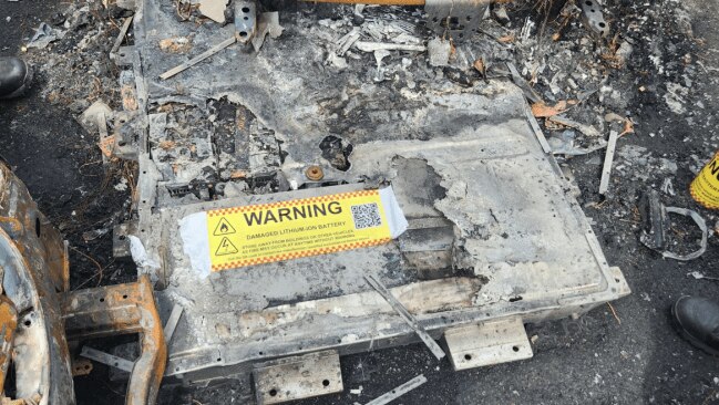 A battery, which had recently been detached from the luxury car and stored in the lot, was quickly identified as having sparked the blaze, according to FRNSW. Picture: FRNSW.