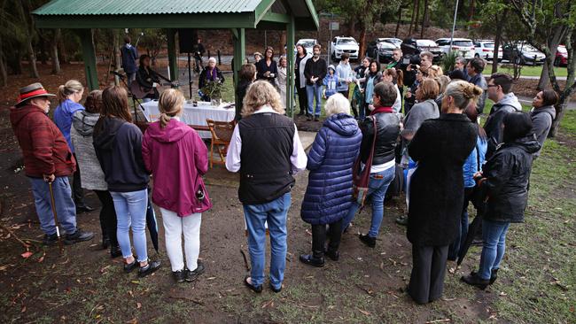 Residents gather for the vigil at Buffalo Creek Reserve. Picture: Adam Yip