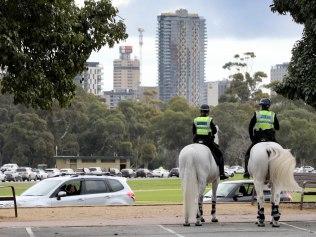 Covid Testing Facitities - Police watch cars lined up heading towards Victoria Park testing station. 21 July 2021. Picture Dean Martin