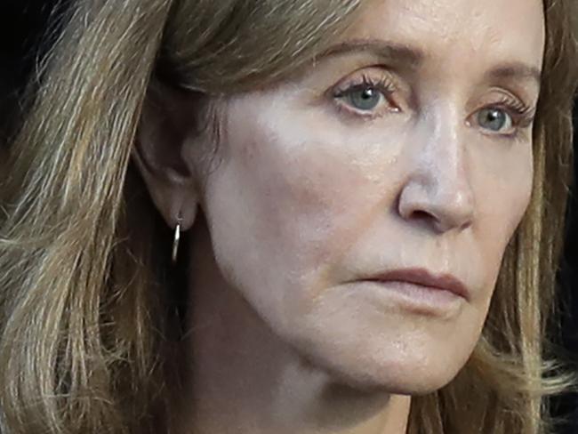 Actress Felicity Huffman leaves federal court after her sentencing in a nationwide college admissions bribery scandal, Friday, Sept. 13, 2019, in Boston. (AP Photo/Elise Amendola)