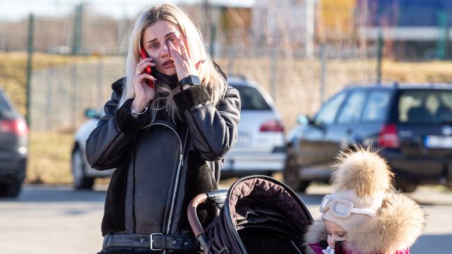 An Ukrainian mother cries after crossing to Poland to seek asylum. Picture: Dominika Zarzycka/NurPhoto