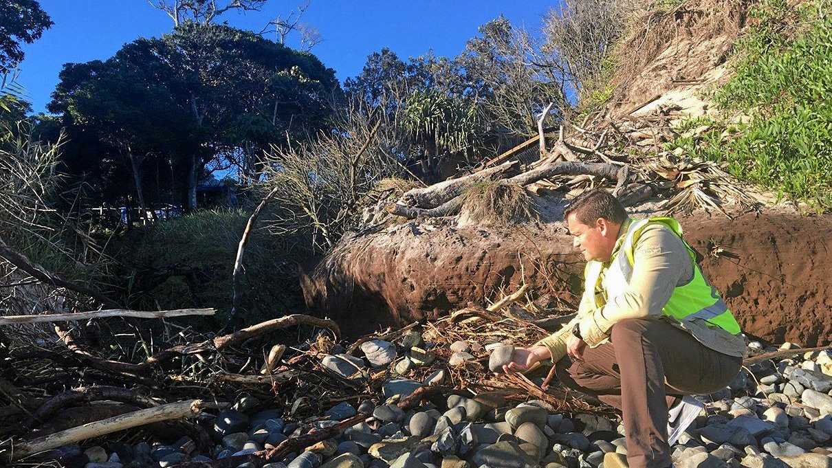 DAMAGE: Group Manager of Operations Steve Bennett inspecting the debris on Clarkes Beach.