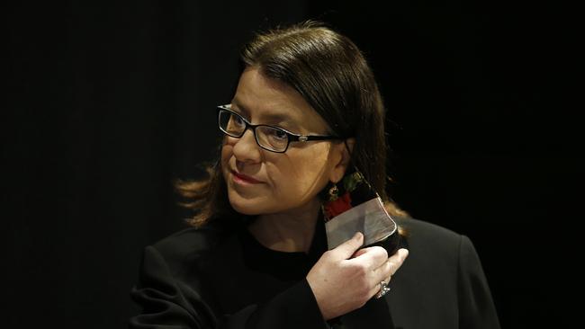 Outgoing Minister for Health Jenny Mikakos removes her mask before addressing media during a press conference in Melbourne. Picture: NCA NewsWire / Daniel Pockett