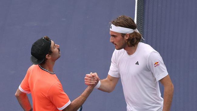 Australia’s Jordan Thompson (L) celebrates his first win over Greece’s Stefanos Tsitsipas. Picture: AFP