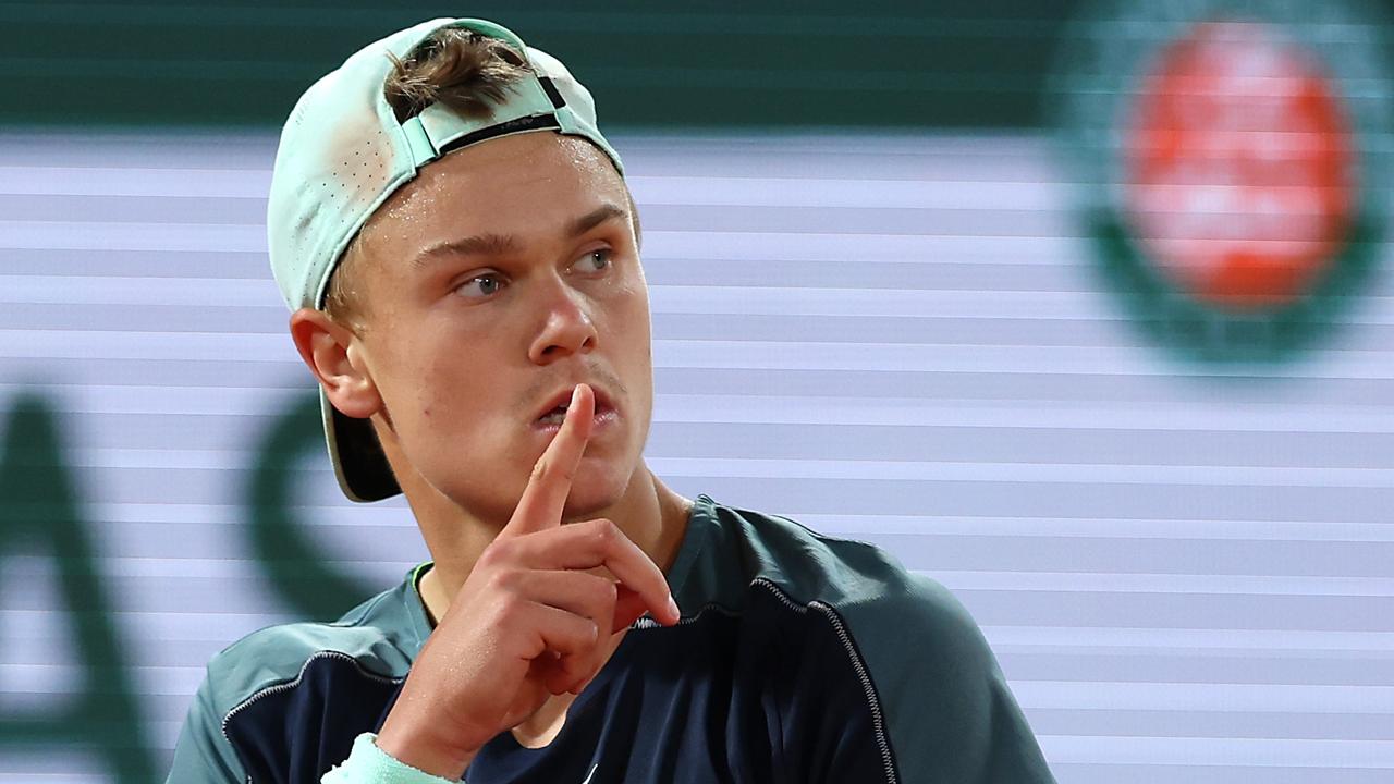 PARIS, FRANCE - JUNE 01: Holger Rune of Denmark gestures to the crowd to be quiet against Casper Ruud of Norway during the Men's Singles Quarter Final match on Day 11 at Roland Garros on June 01, 2022 in Paris, France. (Photo by Clive Brunskill/Getty Images)