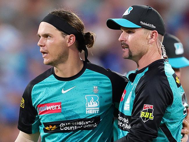 ADELAIDE, AUSTRALIA - JANUARY 11: Mitch Swepson of the Heat celebrates the bowling wicket of Jamie Overton of the Strikers for 6 runs with Colin Munro of the Heat during the BBL match between Adelaide Strikers and Brisbane Heat at Adelaide Oval, on January 11, 2025, in Adelaide, Australia. (Photo by Sarah Reed/Getty Images)