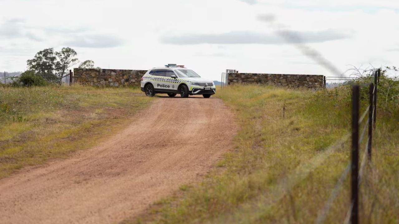 Officers cordoned off Uriarra Village as part of the operation. Picture: ABC News / Adam Kennedy