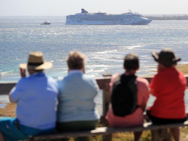 Onlookers watch as the cruise ship is towed. Picture: Alex Coppel