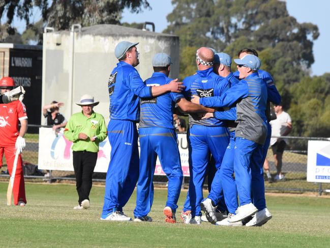 Jayde Herrick is mobbed by his Langwarrin teammates on Saturday. Picture: Damien Wust