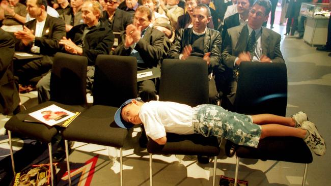 Tim Tszyu, 7, has a rest during his dad’s press conference in 2002.