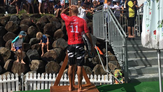 Kelly Slater pictured showering after his second round lose to Stu Kennedy from Lennox Head. Picture: Nic McElroy