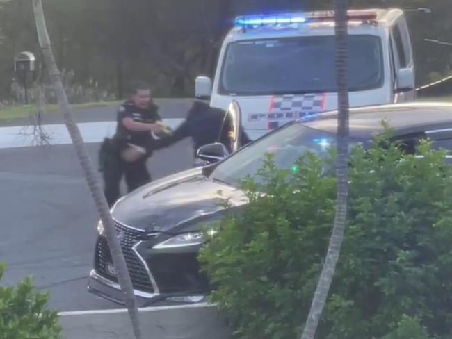 She tases him as he leaps out of the car. Picture: Benjamin Heremaia