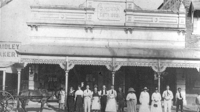 The building pictured in 1922, with the then owner Charles Wyman, son of G Wyman, second from the right. Picture: Contributed