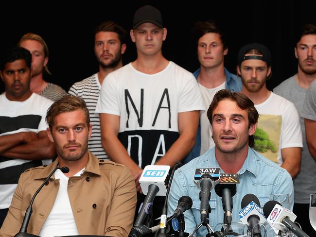 MELBOURNE, AUSTRALIA - MARCH 31:  Jobe Watson the captain of the Bombers, flanked by his team mates talks to the media at the Pullman Hotel on March 31, 2015 in Melbourne, Australia. The AFL anti-doping tribunal today announced that 34 past and present Essendon Bombers AFL players have been found not guilty of taking a banned substance.  (Photo by Quinn Rooney/Getty Images)