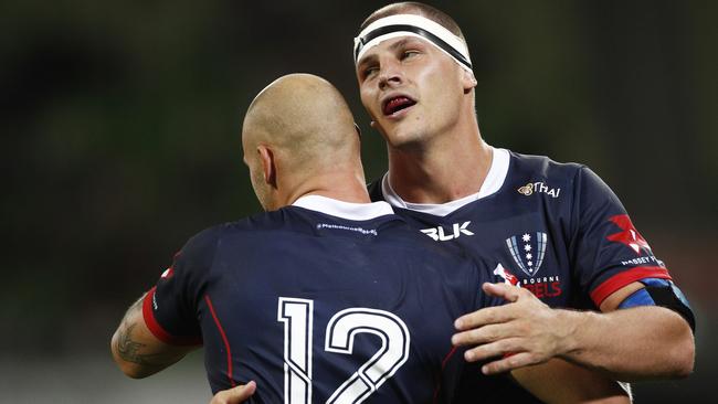 Luke Jones of the Rebels (right) celebrates a Bill Meakes try during the Round 3 Super Rugby match between the Melbourne Rebels and the Highlanders at AAMI Park.