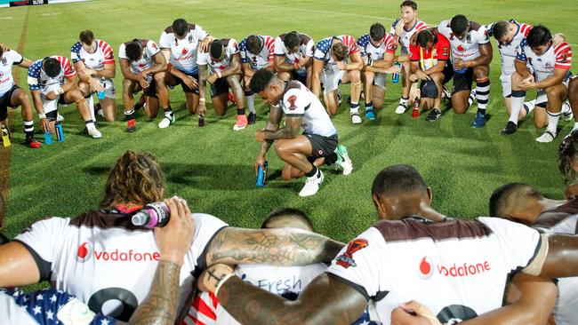 Kevin Naiqama, captain of Fiji leads both teams in a prayer after their World Cup encounter.