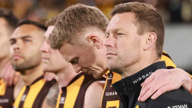 ADELAIDE, AUSTRALIA - SEPTEMBER 13: Sam Mitchell, Senior Coach of the Hawks during the national anthem during the 2024 AFL Second Semi Final match between the Port Adelaide Power and the Hawthorn Hawks at Adelaide Oval on September 13, 2024 in Adelaide, Australia. (Photo by James Elsby/AFL Photos via Getty Images)