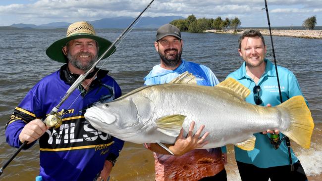 Townsville Barramundi Restocking Group President Rhyce Bullimore flanked by Townsville City councillors Kristian Price and Brady Ellis at Ross River Dam. Picture: Evan Morgan