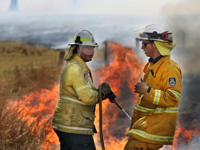 Smoke billows around Hillville in NSW as property owners fight to save their homes. Picture: Gary Ramage