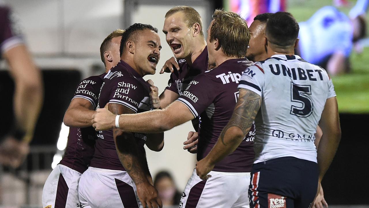 Dylan Walker celebrates with Manly teammates. Picture: Getty