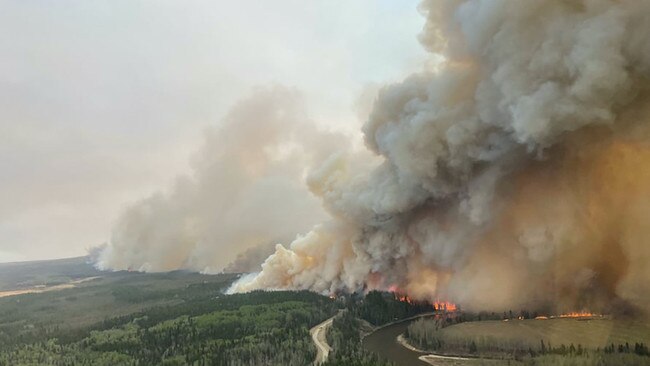 A smoke column rises from a bushfire near Shining Bank, Alberta. Picture: Reuters