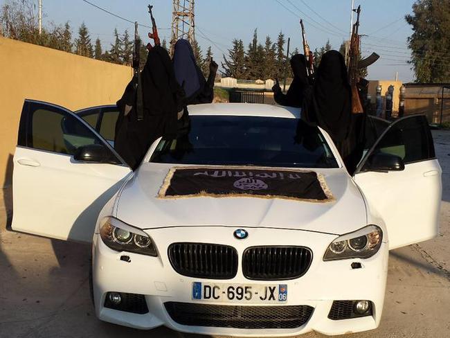 European imported BMW sports car draped with IS flag allegedly used by Khaled Sharrouf and Mohamed Elomar in Syria.